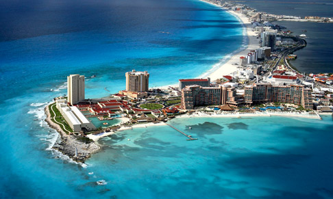 aerial view of cancun resort surrounded by ocean