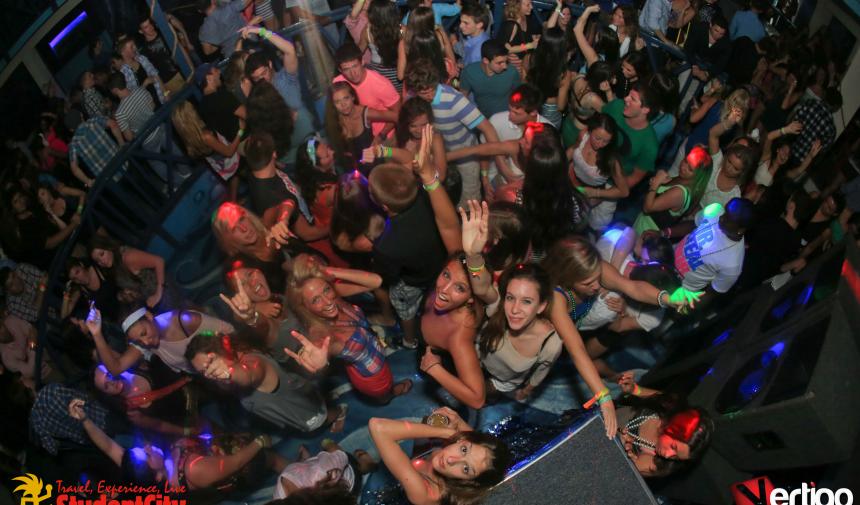overhead shot of a group of high school students dancing in a club on Spring break