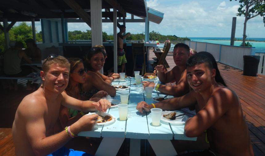 high school students eating at a picnic table in Nassau