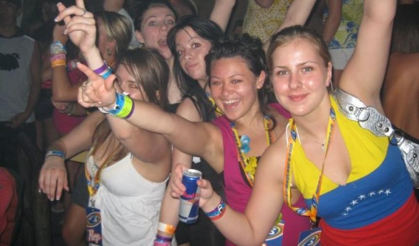 a group of girls posing on the dance floor
