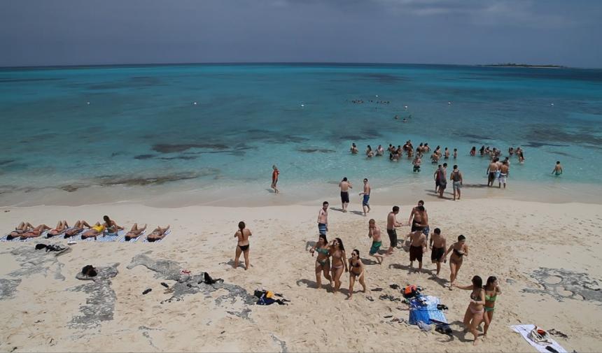 Students on the beach on a graduation trip to Cancun, Mexico