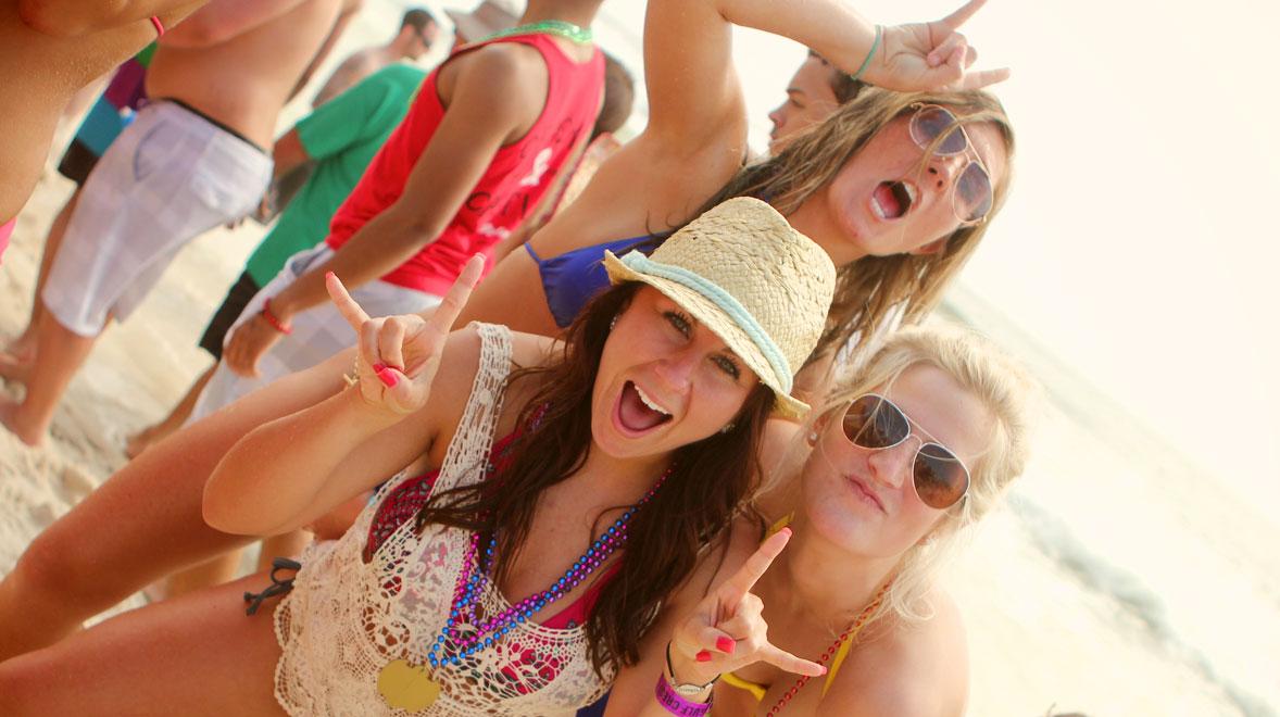 girls posing for a photo during their high school spring break in Panama City Beach