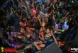 overhead shot of a group of high school students dancing in a club on Spring break