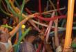 a crowd of people with balloons on a Cancun graduation trip