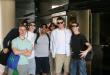 a group of high school students posing for a photo outside of their hotel in Nassau, Bahamas