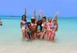 A group of girls in the water at the beach