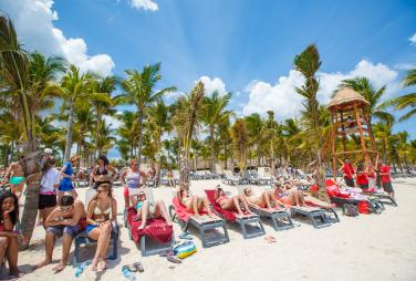 Students on the beach at a family friendly resort in Punta Cana
